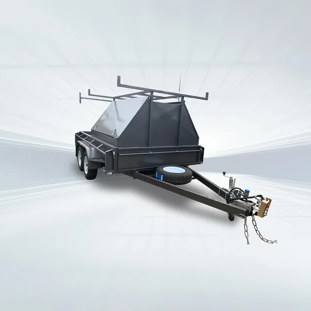 Studio side angled view of black 10x5 tradesman trailer with half canopy top and roof rack on white background.