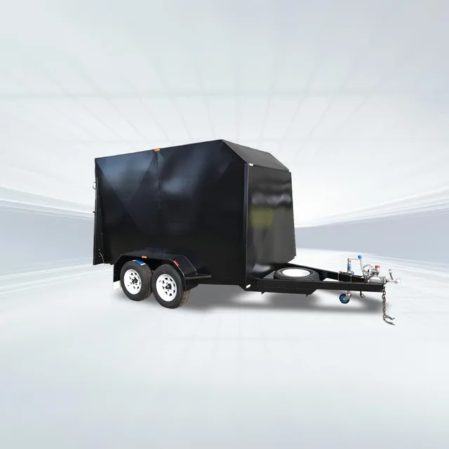 Studio or yard side view of black 10x6 enclosed trailer with 3200kg GVM, 7ft internal height, and rear ramp.