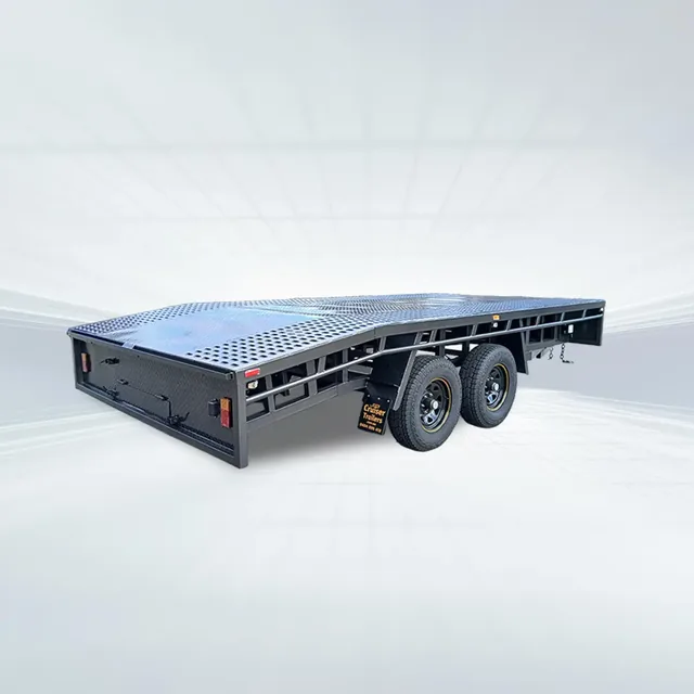Studio shot of black 4.8m x 2.4m beavertail flat top trailer with 3500kg GVM and perforated sheet floor.