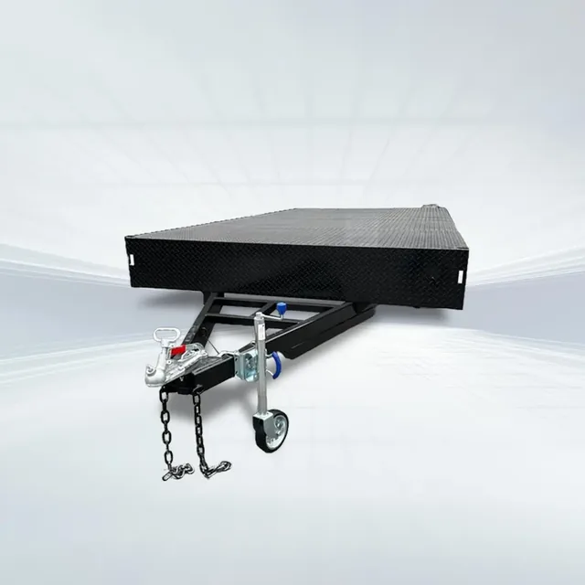 Studio shot of black 4.8m x 2.4m flat top beavertail trailer with 3500kg GVM, perforated checker plate deck, and front view on white background.