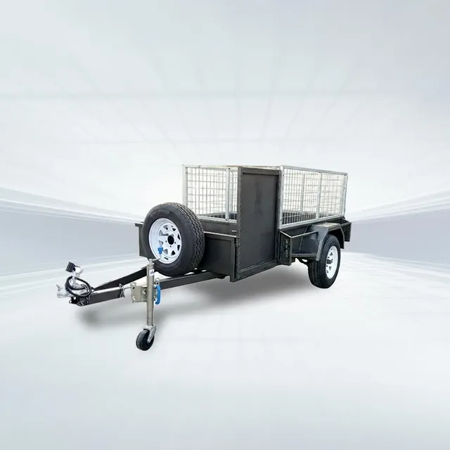 Side angled studio view of black 6x4 lawn mower trailer with 600mm high mesh cage and open mower box.