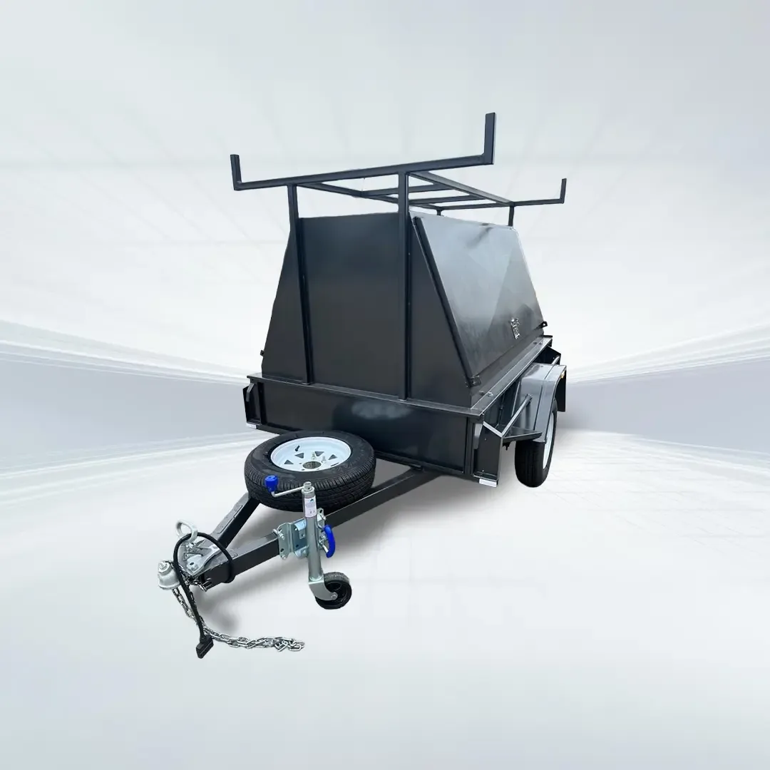 Studio side angled view of black 6x4 tradesman trailer with flip-top canopy and roof rack on white background.