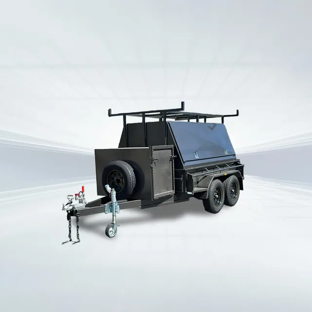 Studio side angled view of black 8x5 tradesman trailer with compressor box and full canopy on white background.